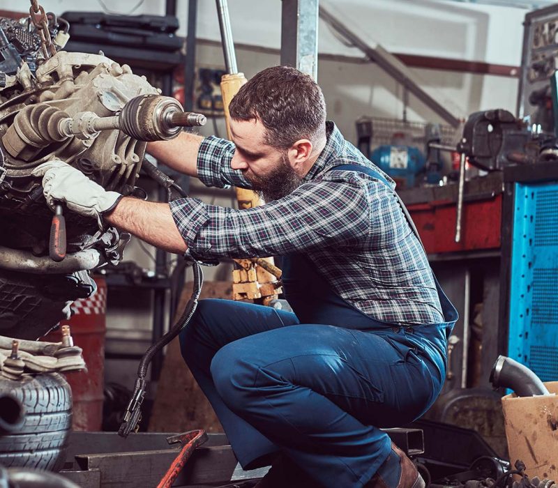 brutal-tattooed-mechanic-repairs-the-car-engine-in-small.jpg